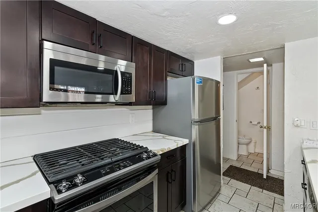 a kitchen with a stove and a microwave