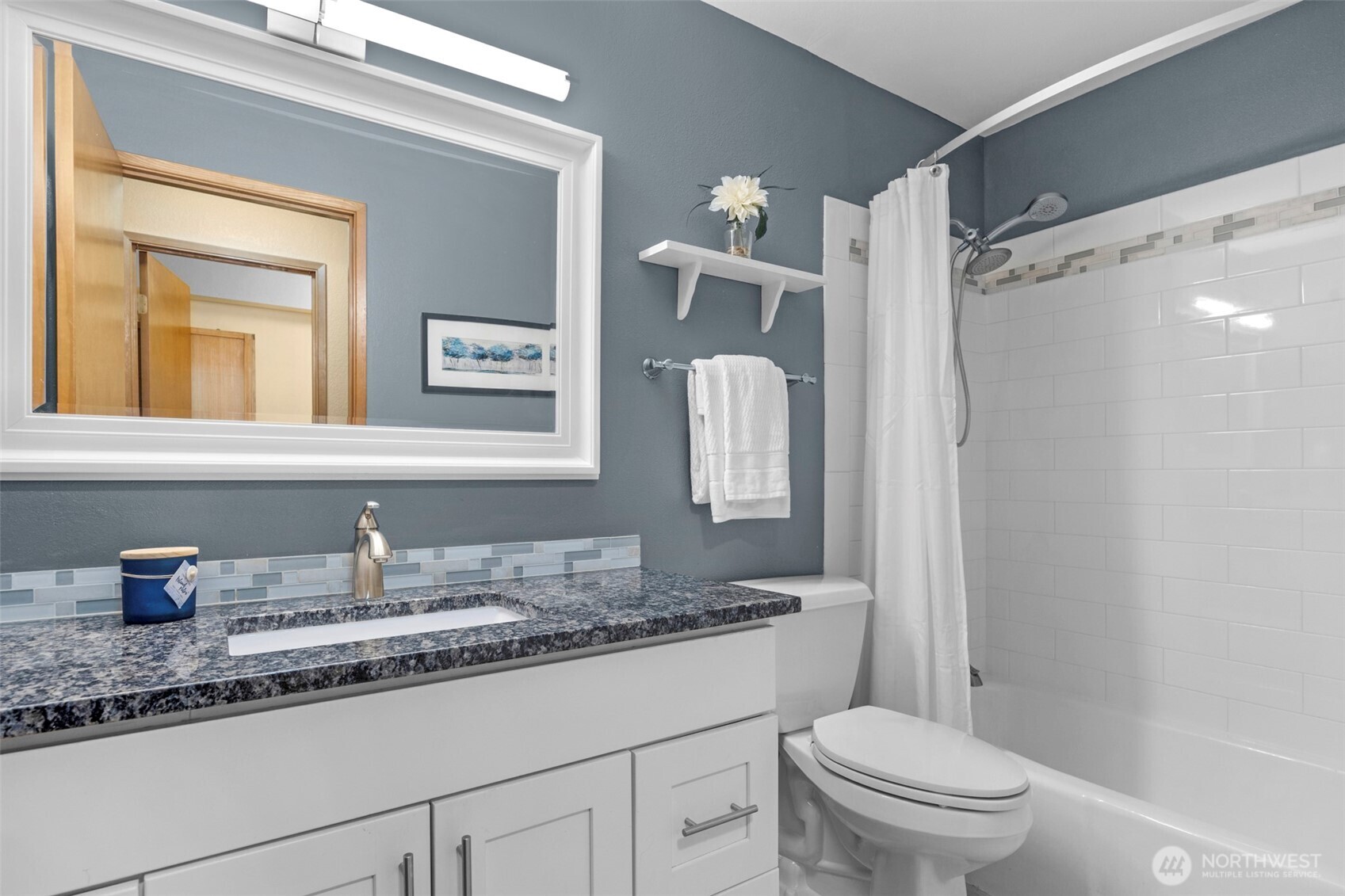 200 James Street, Unit 307 Edmonds, WA 98020 - Photo 14 of 37 a bathroom with a granite countertop sink toilet and shower