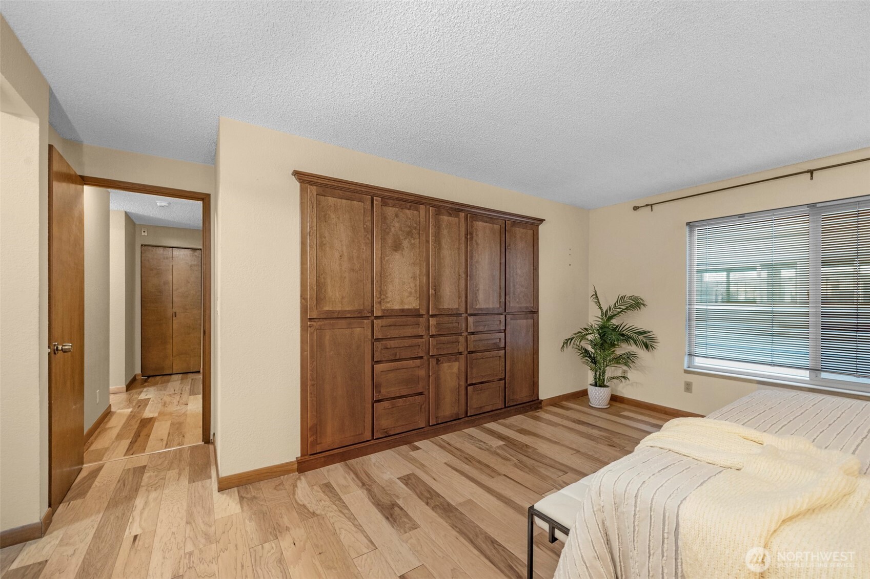 200 James Street, Unit 307 Edmonds, WA 98020 - Photo 15 of 37 a bedroom with a bed and a dresser