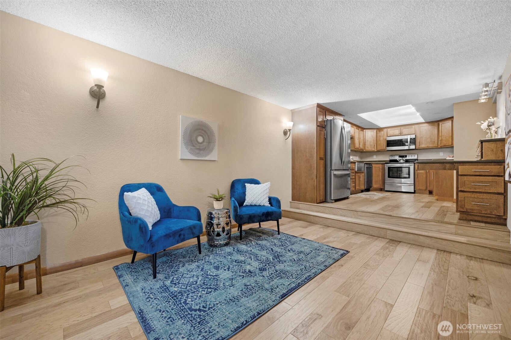 200 James Street, Unit 307 Edmonds, WA 98020 - Photo 19 of 37 a living room with furniture and a rug