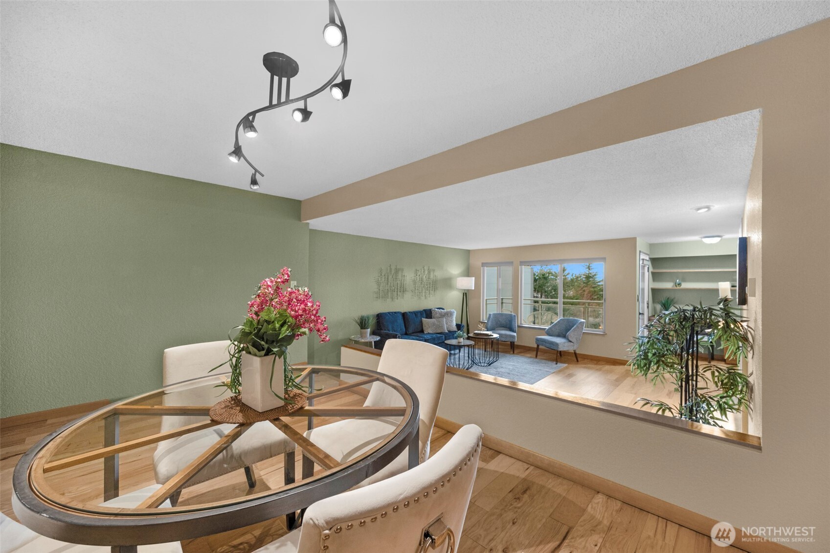 200 James Street, Unit 307 Edmonds, WA 98020 - Photo 25 of 37 a dining room with furniture and wooden floor