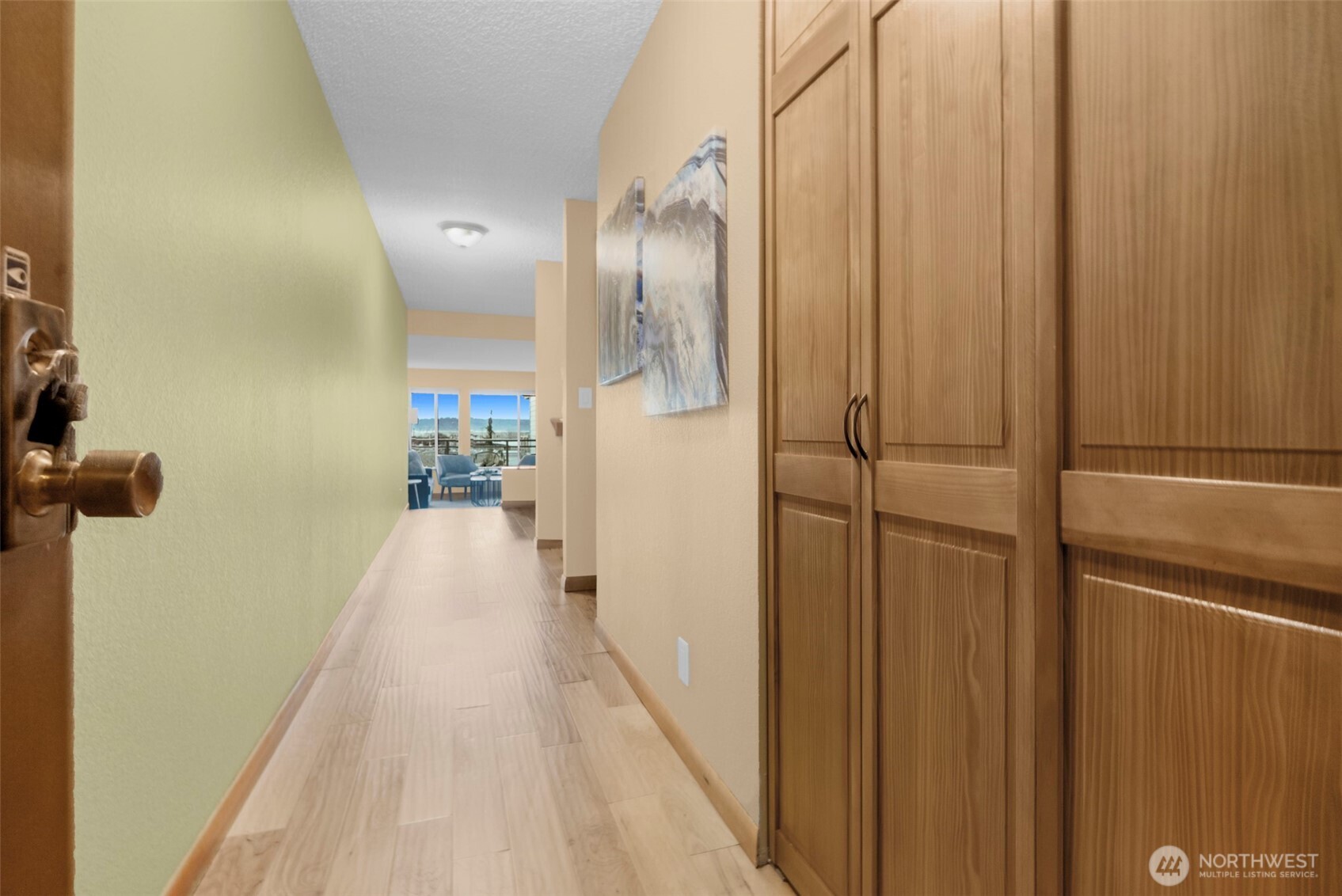 200 James Street, Unit 307 Edmonds, WA 98020 - Photo 9 of 37 a view of a hallway with wooden floor