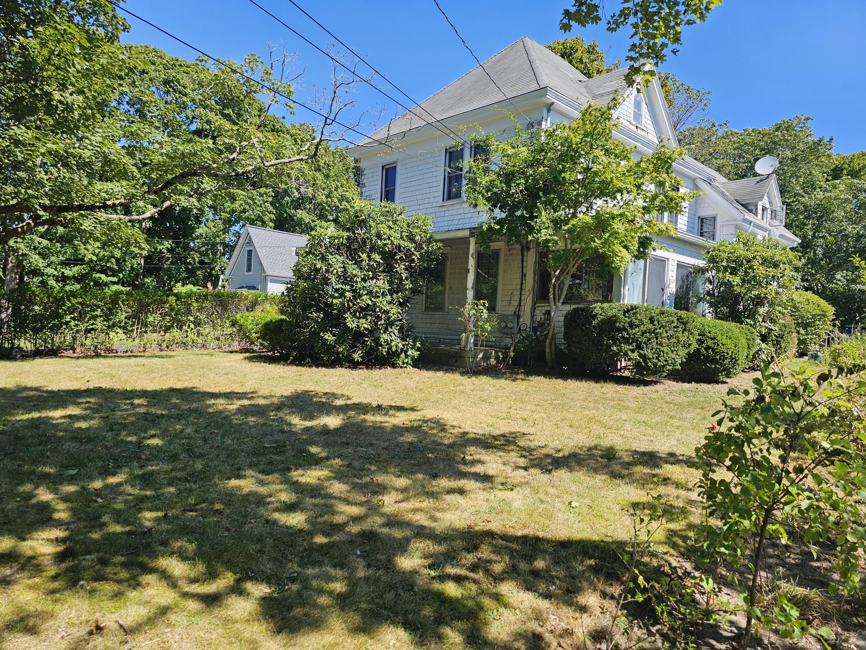 33 John Parker Road East Falmouth, MA 02536 - Photo 1 of 12 a view of yellow house with a yard