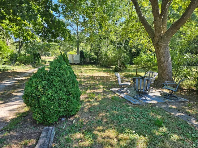 a view of a fire pit in a backyard