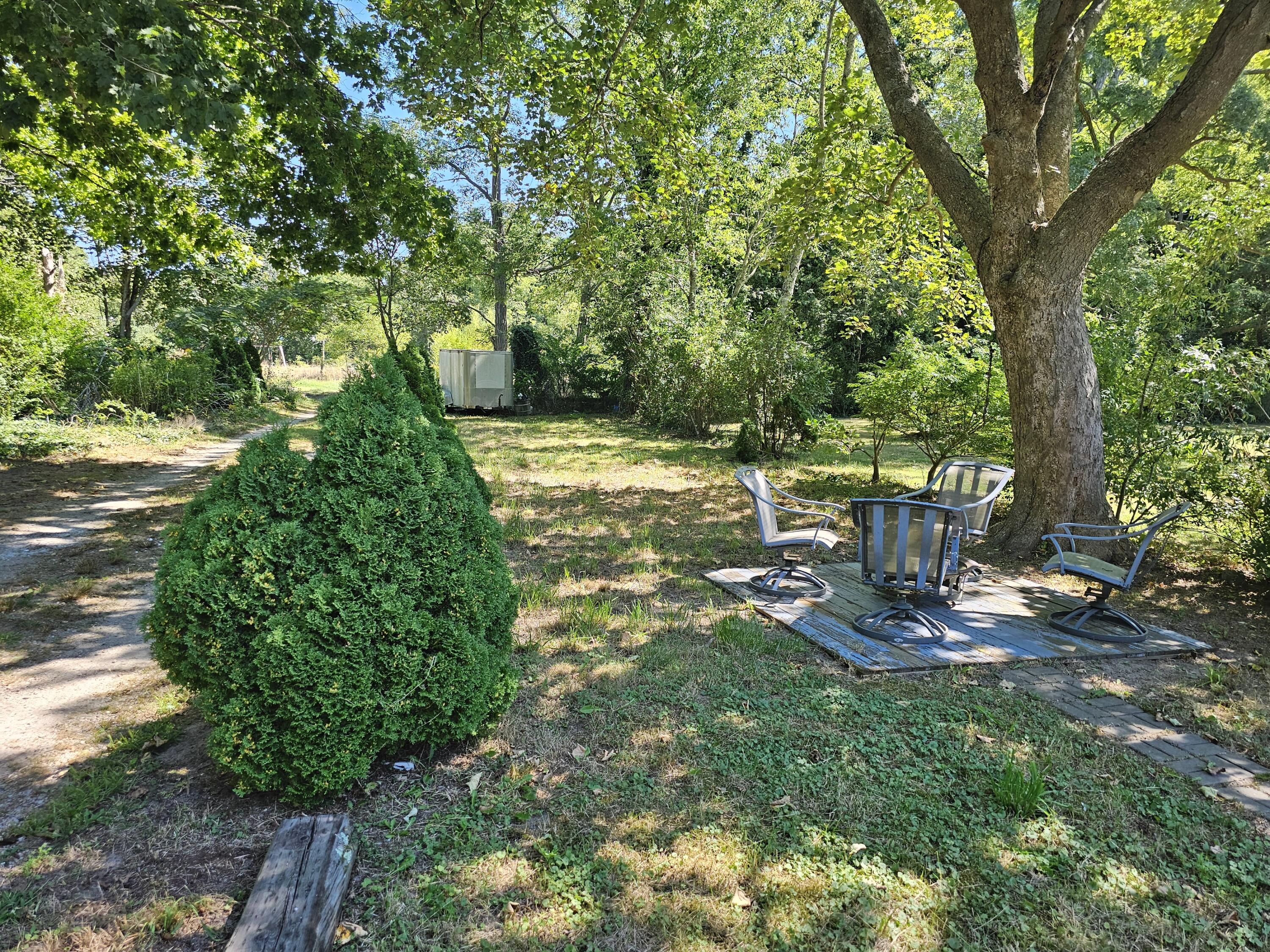 33 John Parker Road East Falmouth, MA 02536 - Photo 3 of 12 a view of a fire pit in a backyard