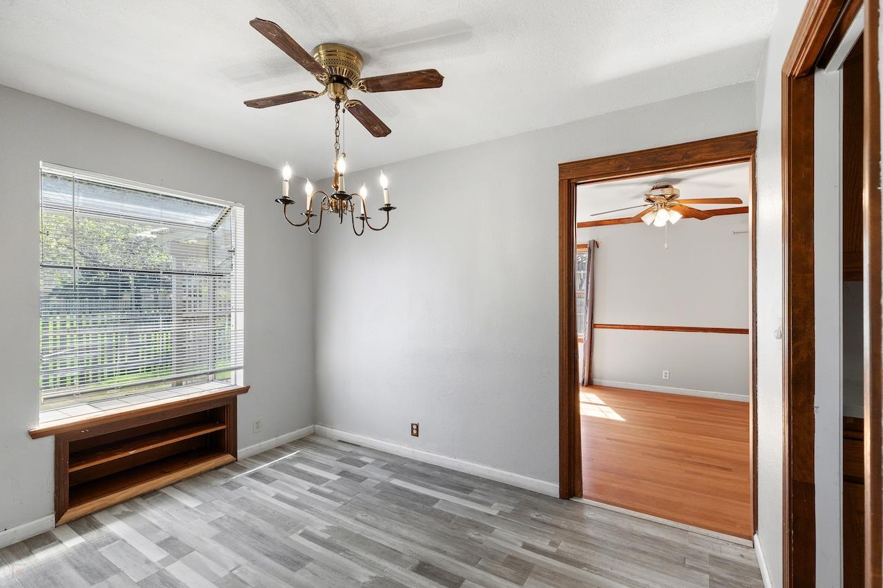 1460 Ridgecrest Drive Manteca, CA 95336 - Photo 18 of 54 a view of empty room with wooden floor and fan