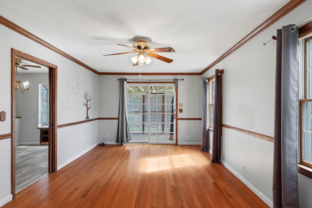 1460 Ridgecrest Drive Manteca, CA 95336 - Photo 24 of 54 a view of empty room with wooden floor and fan