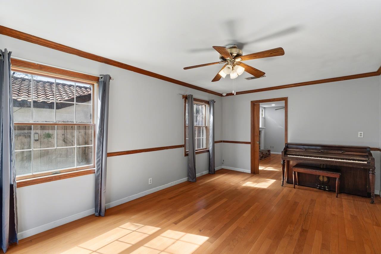 1460 Ridgecrest Drive Manteca, CA 95336 - Photo 26 of 54 a view of empty room with wooden floor and fan