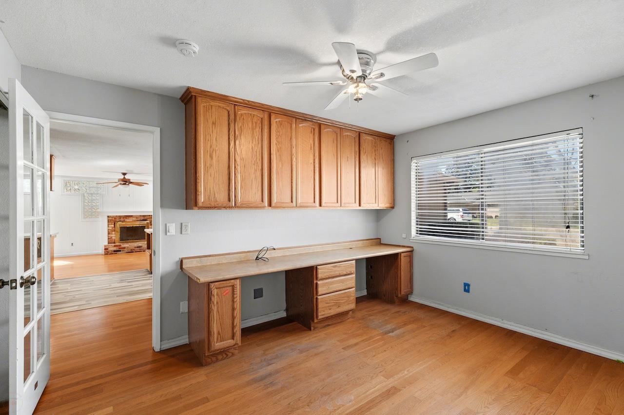 1460 Ridgecrest Drive Manteca, CA 95336 - Photo 29 of 54 a kitchen with stainless steel appliances granite countertop a sink cabinets and wooden floor