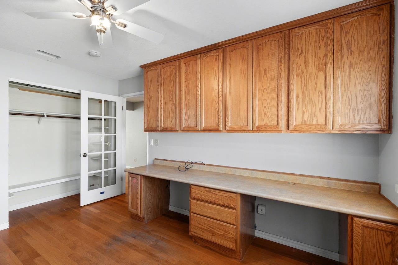 1460 Ridgecrest Drive Manteca, CA 95336 - Photo 30 of 54 a room with cabinets and wooden floor