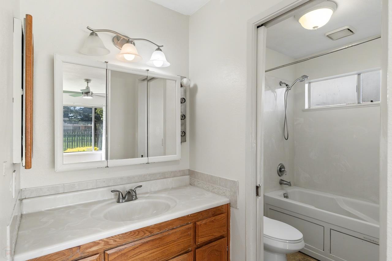 1460 Ridgecrest Drive Manteca, CA 95336 - Photo 34 of 54 a bathroom with a sink a toilet and shower
