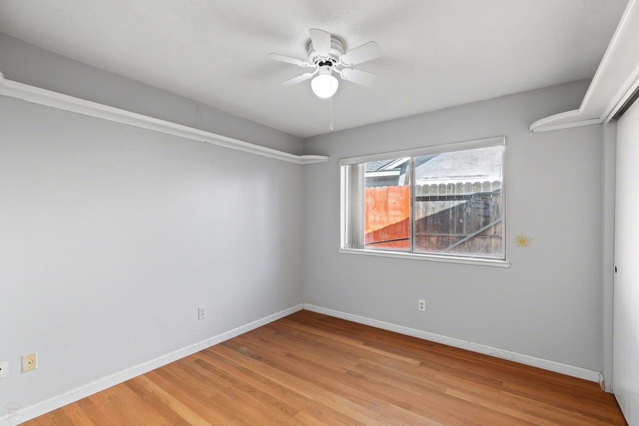 1460 Ridgecrest Drive Manteca, CA 95336 - Photo 36 of 54 wooden floor in an empty room with a window