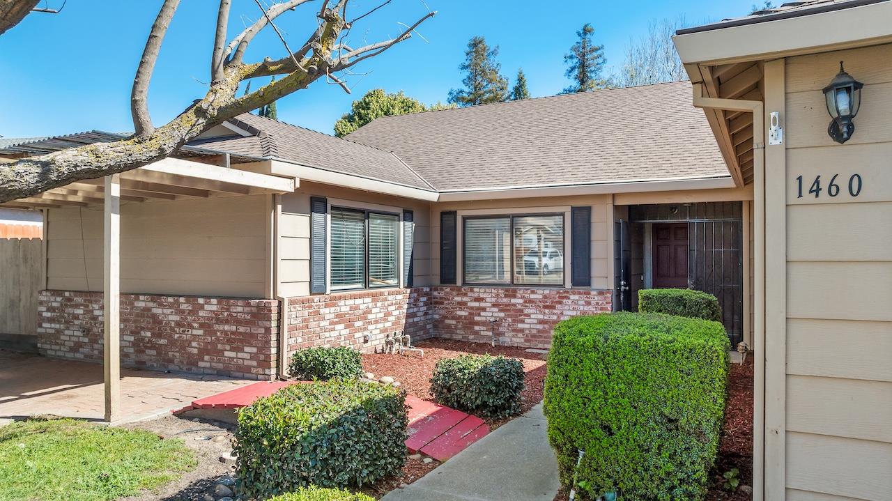 1460 Ridgecrest Drive Manteca, CA 95336 - Photo 4 of 54 a view of house with street sign