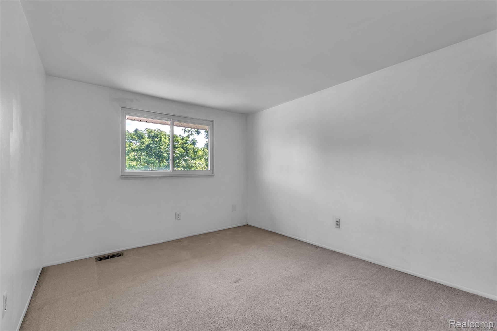 7000 Woonsocket Street Canton, MI 48187 - Photo 39 of 65 Carpeted room featuring a single window and white walls
