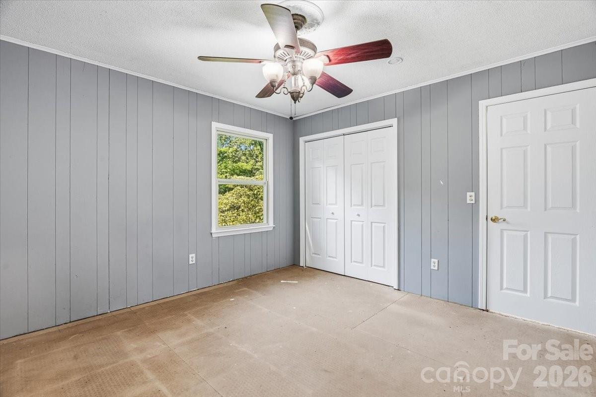 14 Jack Sullins Road Spruce Pine, NC 28777 - Photo 25 of 37 a view of an empty room with window and chandelier fan
