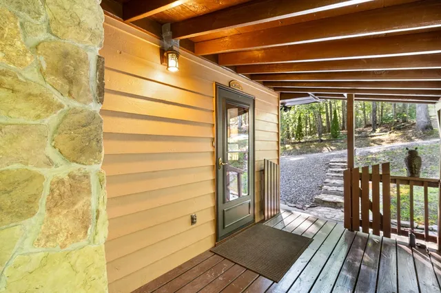a view of a balcony with wooden floor