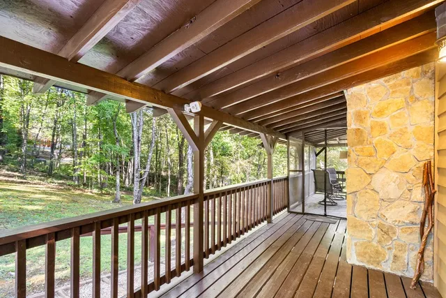 a view of balcony with wooden floor