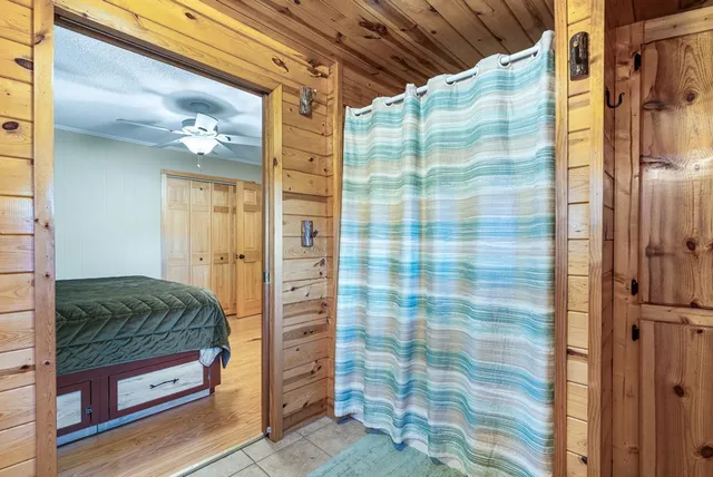 a bathroom with a sink a toilet and a window
