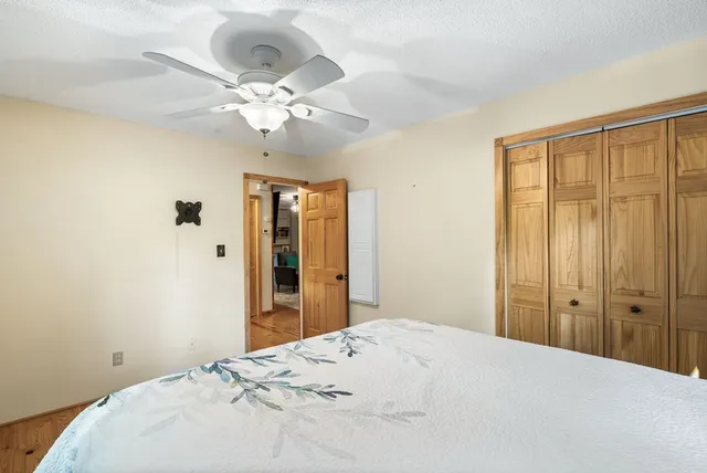 a view of balcony with wooden floor and fence