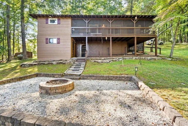 a front view of a house with a garden and patio