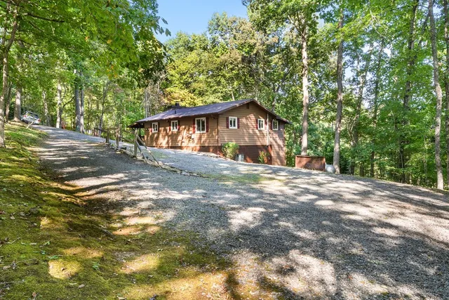 a view of house with yard