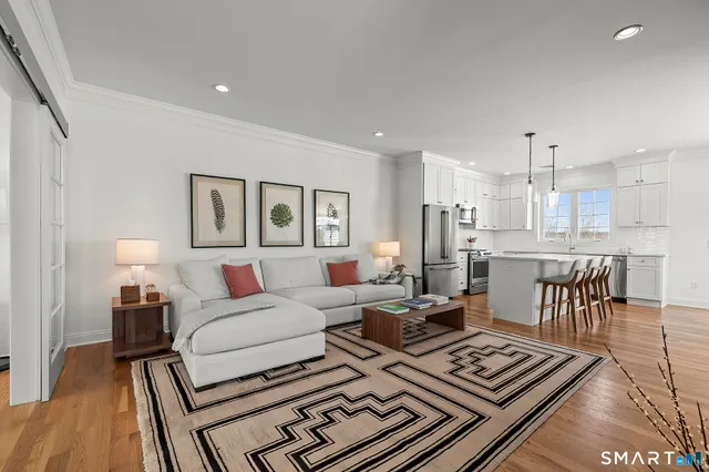 a living room with furniture and a table