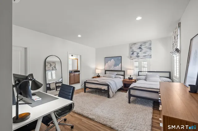 a picture of a bench in front of a wall