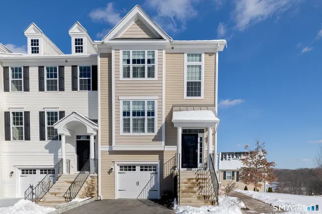 a room with pool table and windows