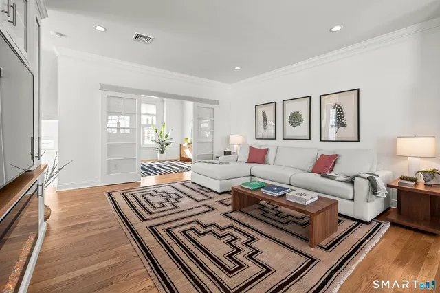 a kitchen with stainless steel appliances kitchen island granite countertop a stove and a refrigerator