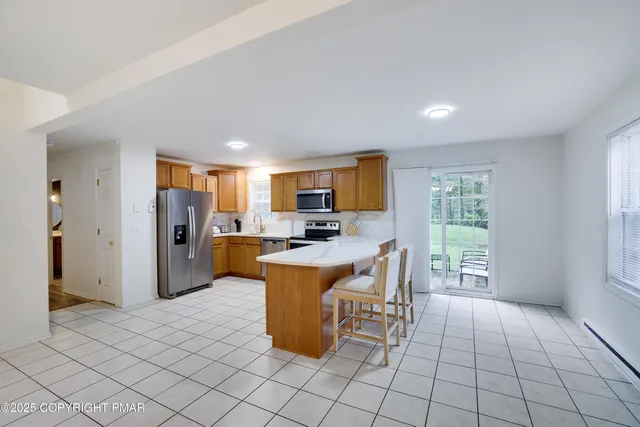 a view of kitchen with furniture and window