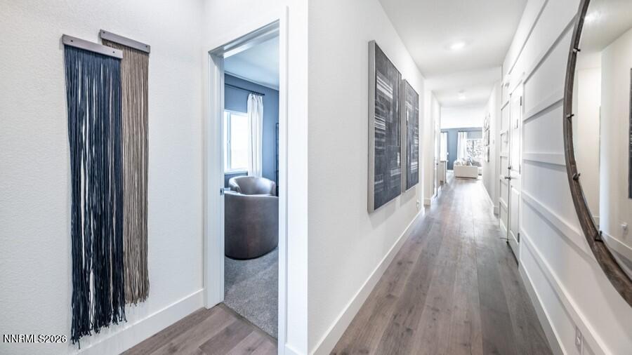 497 Radiant Drive Carson City, NV 89705 - Photo 2 of 23 a view of a hallway with wooden floor and staircase