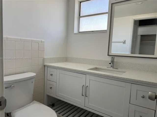 a bathroom with a sink and a toilet