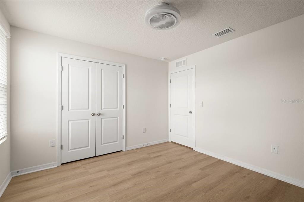 7782 Sail Clover Lane Zephyrhills, FL 33540 - Photo 16 of 22 a view of a room with wooden floor and a sink