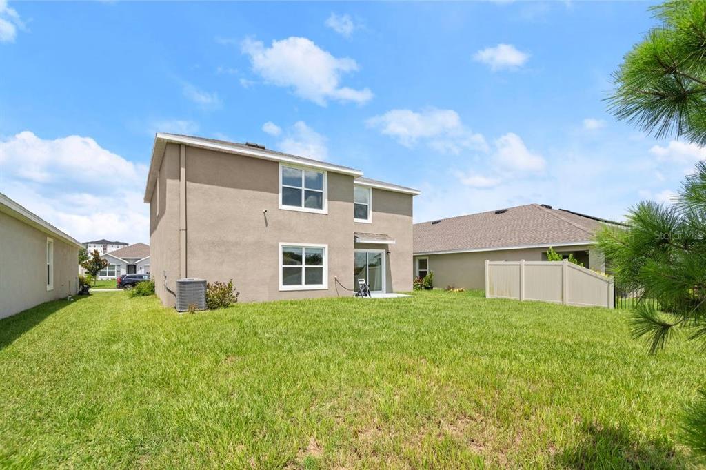 7782 Sail Clover Lane Zephyrhills, FL 33540 - Photo 19 of 22 a house view with a garden space