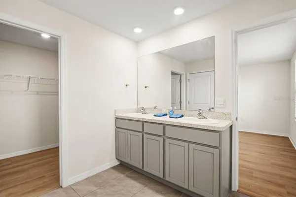 a view of bathroom with dual sinks