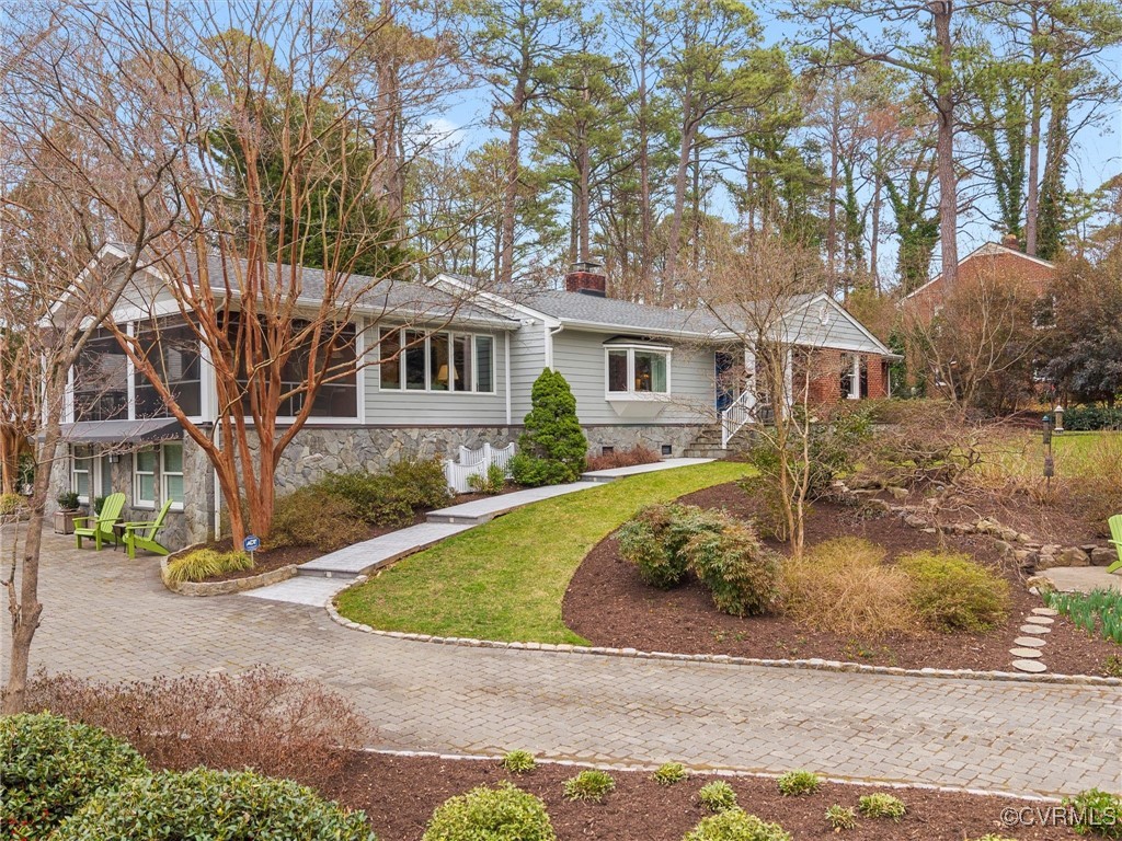 a front view of a house with garden