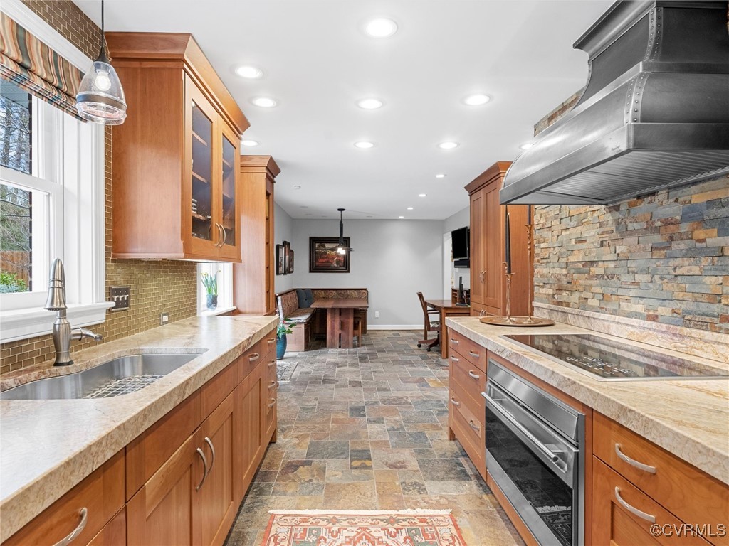 8654 Fieldcrest Road Richmond, VA 23235 - Photo 16 of 48 a kitchen with stainless steel appliances granite countertop a sink stove and cabinets