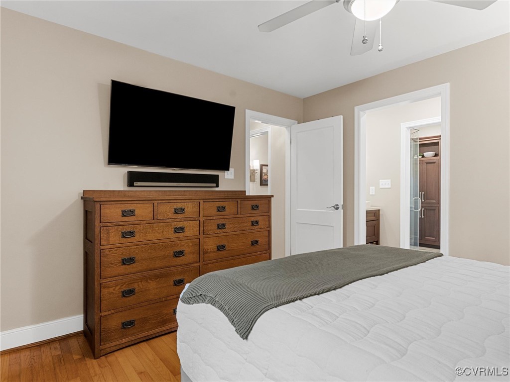 8654 Fieldcrest Road Richmond, VA 23235 - Photo 29 of 48 a bedroom with a bed and a flat screen tv