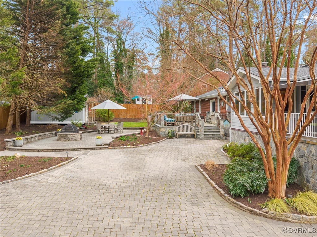 8654 Fieldcrest Road Richmond, VA 23235 - Photo 3 of 48 a view of a building with a yard and trees