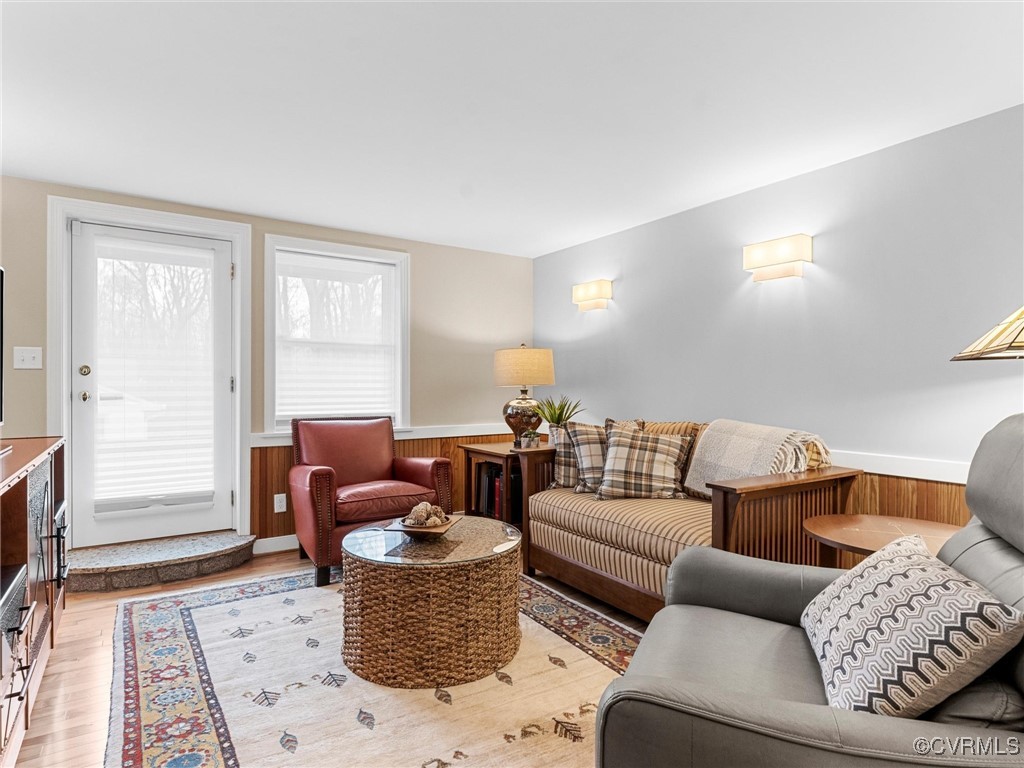 8654 Fieldcrest Road Richmond, VA 23235 - Photo 34 of 48 a living room with furniture a flat screen tv and a window