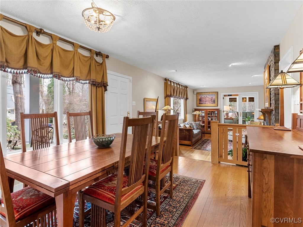 8654 Fieldcrest Road Richmond, VA 23235 - Photo 10 of 48 a living room with furniture a dining table and a bookshelf