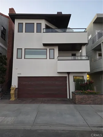 a front view of a house with garage