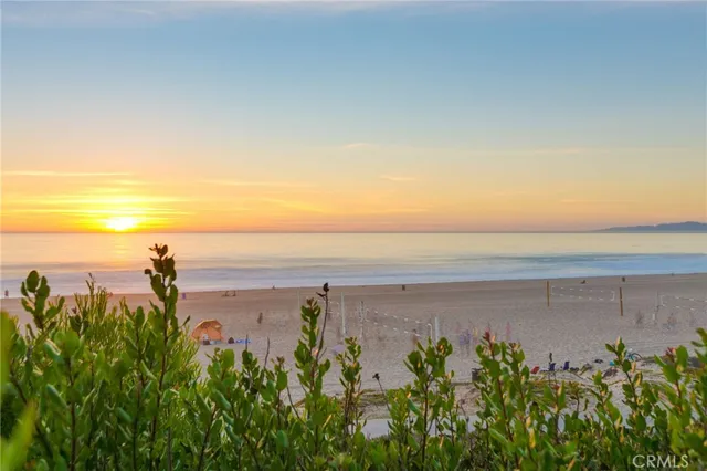 a view of a beach with a city view
