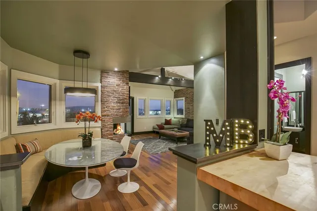 a dining room with furniture and window