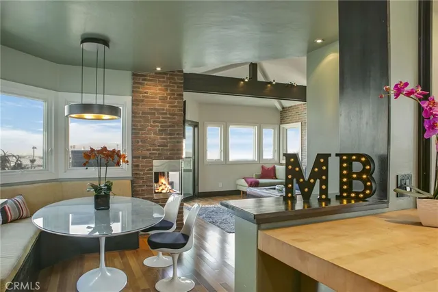 a kitchen with a table chairs and a dining table
