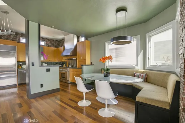 a living room with a table or chairs and a wooden floor