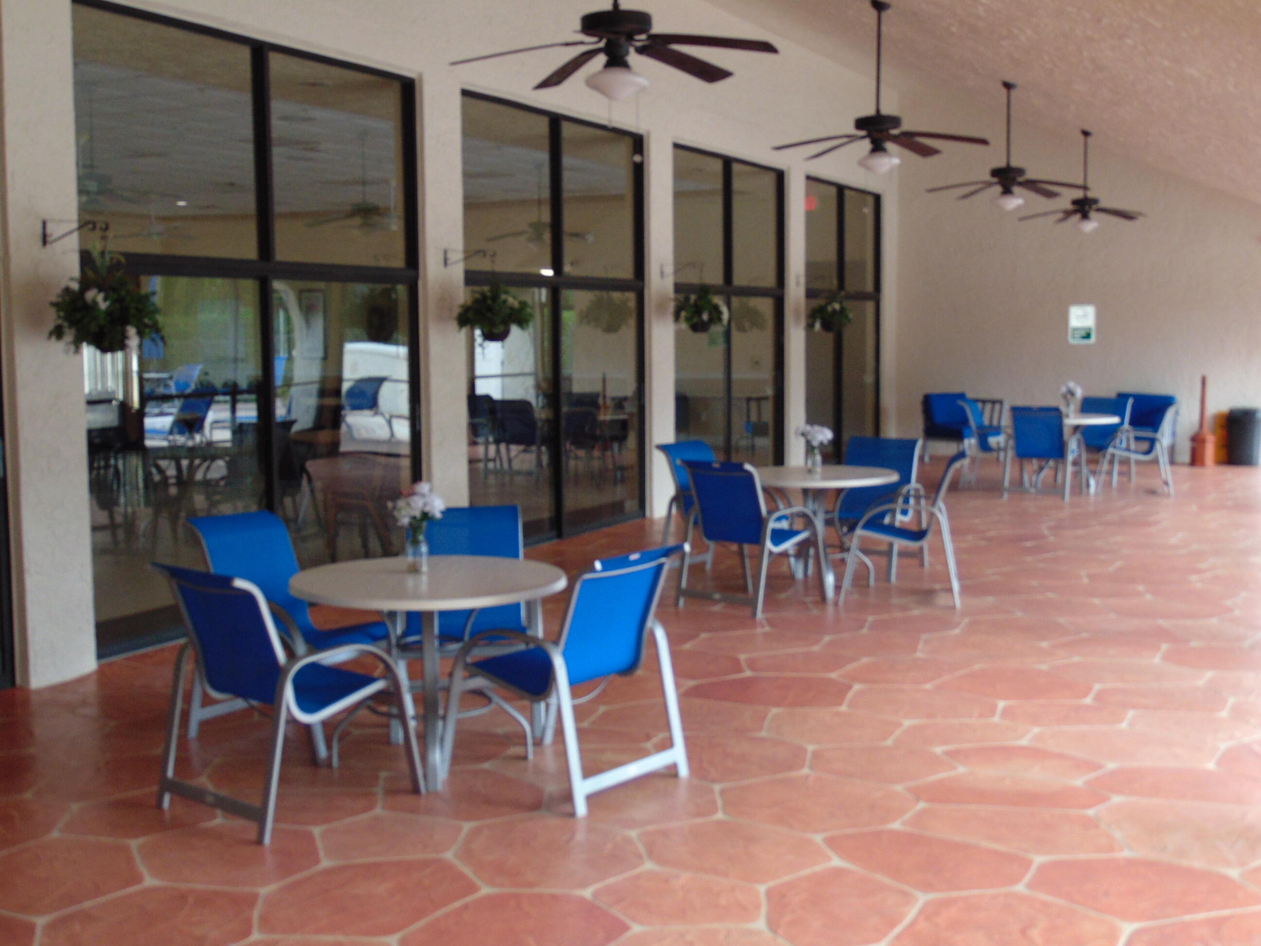 9220 Southwest 14th Street, Unit 3103 Boca Raton, FL 33428 - Photo 45 of 58 a view of a dining room with furniture