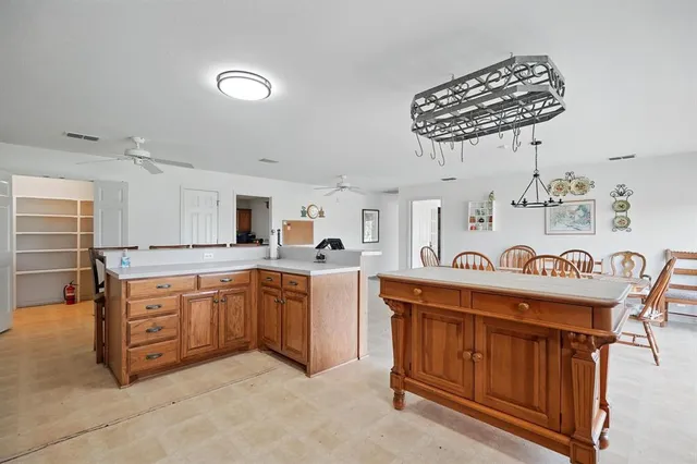 a kitchen with stainless steel appliances granite countertop a sink and cabinets