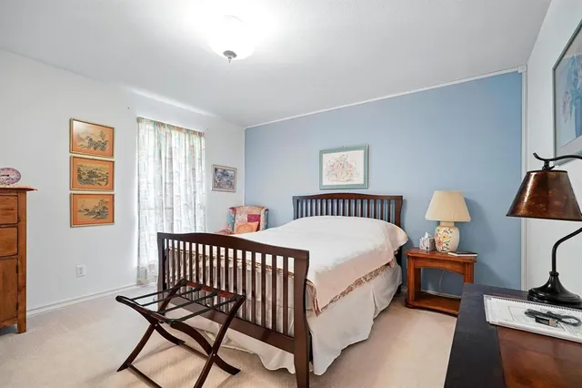 a bed room with a bed and a lamp