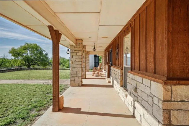 a view of a pathway with a garden